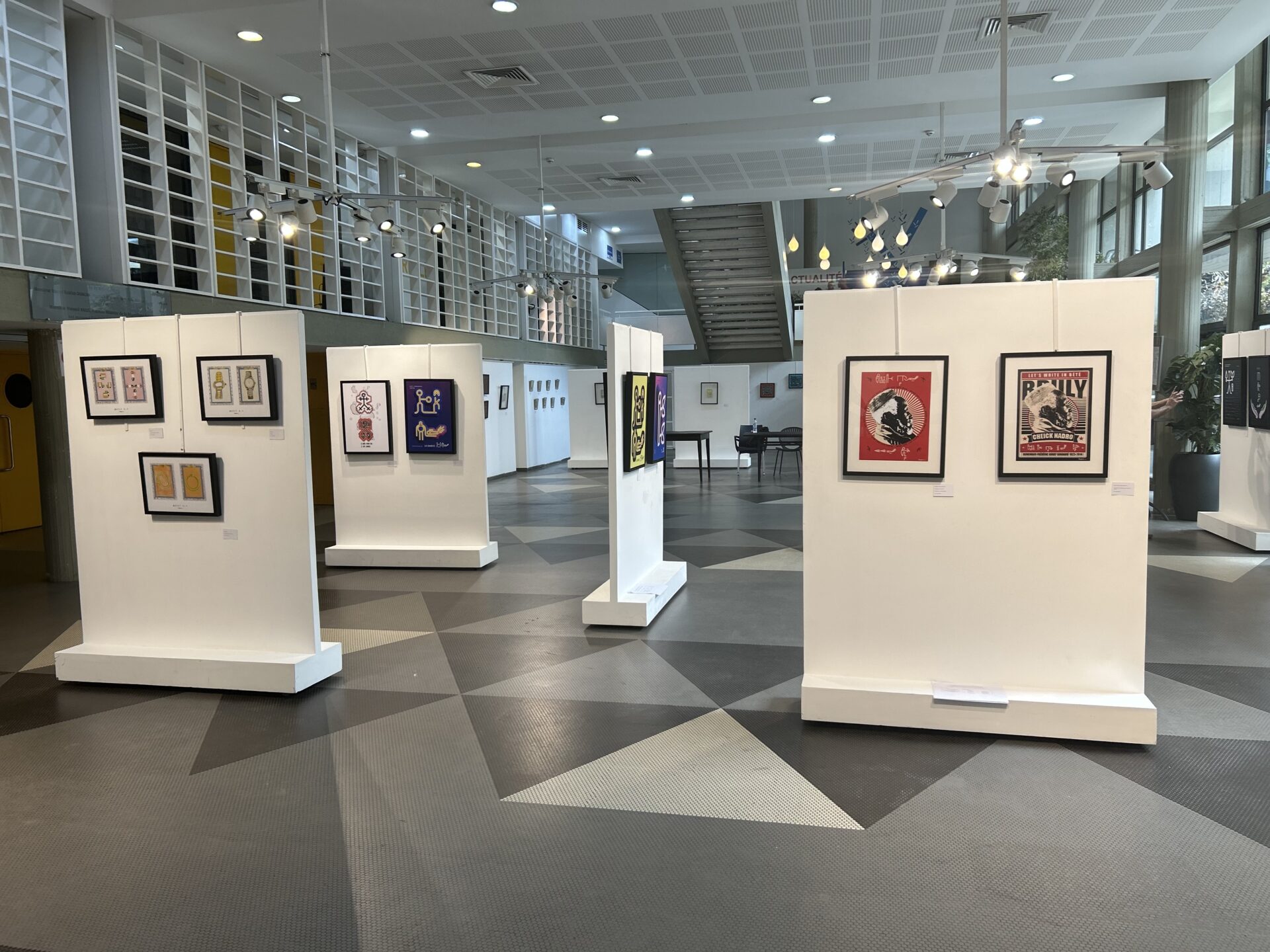 artworks in the Bete script in an art gallery