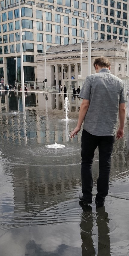 Jan Kucera standing near a fountain